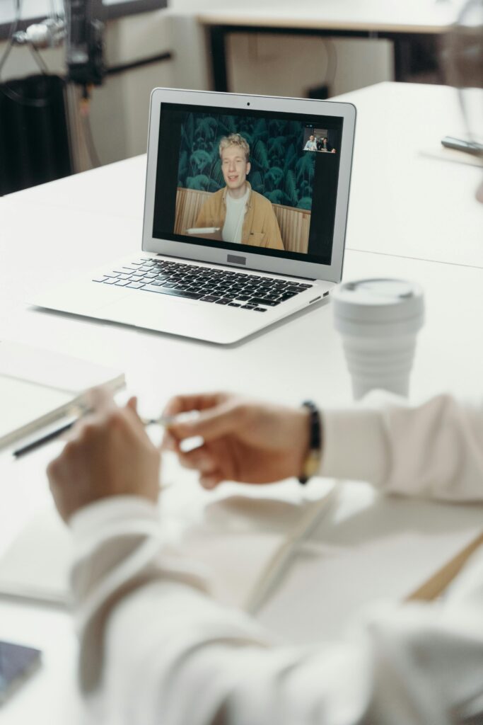 A person on a video call during a meeting.